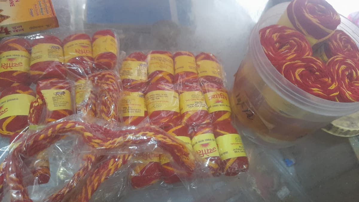 Display of red and yellow moli (kalawa) sacred threads in our shop